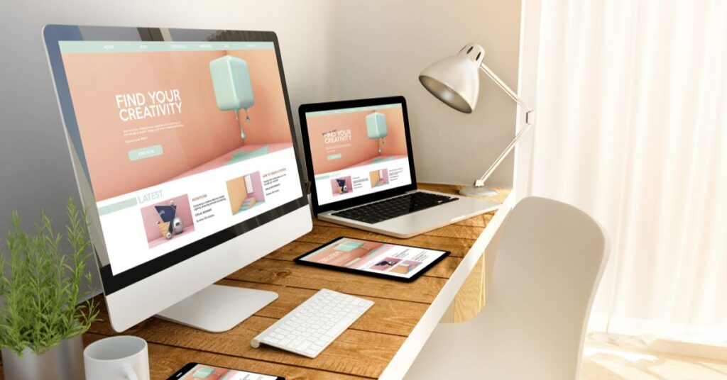 website landing pages displayed on computer screens